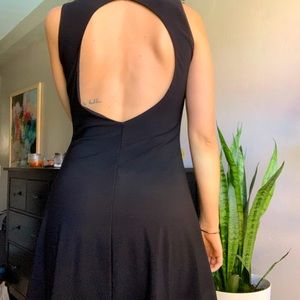 Modest black dress with open back